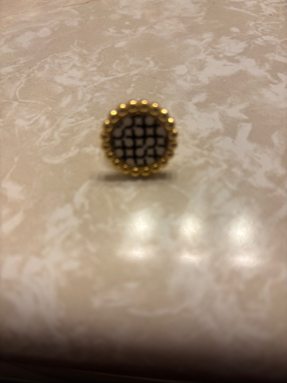 Coach Gold-Tone ring with Black and white logo Center